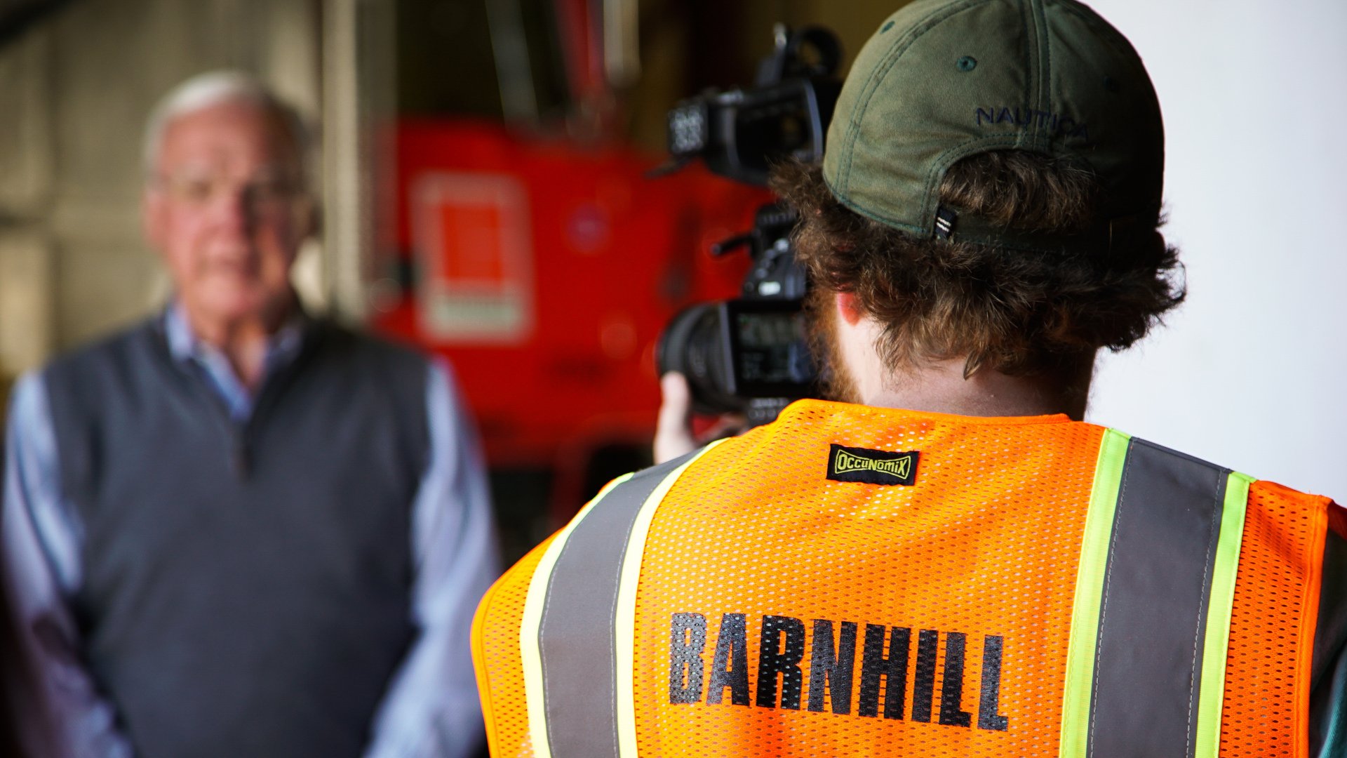 Camera operator wearing Barnhill safety vest